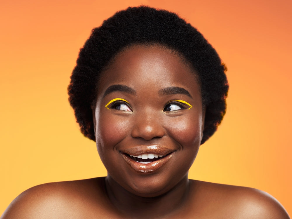 How to Wear Neon Eyeliner on Melanin-rich Skin Like a Pro This Summer